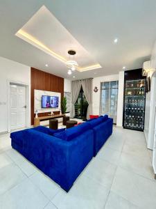 a large blue couch in a living room at Luxurious1 bedroom apart in VI in Lagos