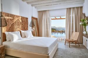 Voodi või voodid majutusasutuse Ubud Mykonos toas