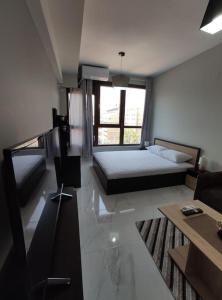 Ένα ή περισσότερα κρεβάτια σε δωμάτιο στο Valaoritou studio 1