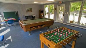 a pool table in a room with a pool table at Cozy Mountain Getaway! Mountain views! 2 bed, 2 bath, Sleeps 6 in Gatlinburg