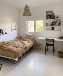a bedroom with a bed and a desk and a chair at Luxury Villa Heleni in Herzliya