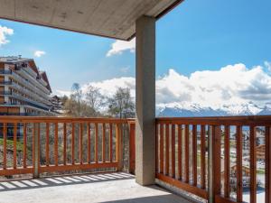 a balcony with a view of the mountains at Apartment Les Chouettes 23 by Interhome in Nendaz