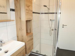 a bathroom with a shower and a sink at Apartment Seestern by Interhome in Hooksiel
