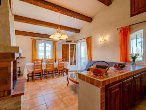 a kitchen and living room with a table and chairs at Apartment Bauduen by Interhome in Bauduen