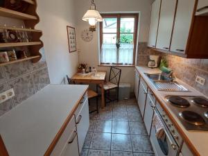 a kitchen with a sink and a table in it at Apartment Alte Post-1 by Interhome in Aggsbach