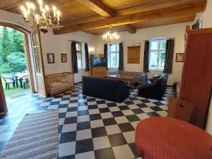 a living room with a checkered floor at Apartment Alte Post-2 by Interhome in Aggsbach