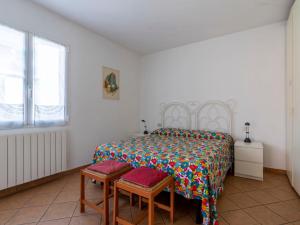 A bed or beds in a room at Apartment Sorei by Interhome