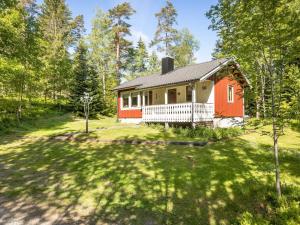 a house in the woods with a yard at Chalet Mjöhult Skogen - HAL022 by Interhome in Ätran