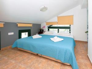 Ένα ή περισσότερα κρεβάτια σε δωμάτιο στο Villa heaven by Interhome