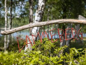 a sign with the word garden hanging from a branch at Holiday Home Dammeberg - HAL033 by Interhome in Karl Gustav