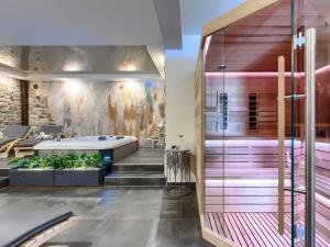 a wellness room with a bath tub and a wall at Holiday Home Panorama 2 by Interhome in Labin