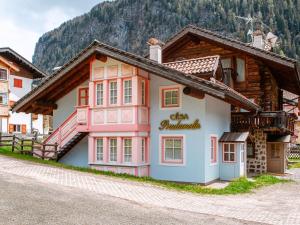 a building in a village in the mountains at Apartment Cesa Pra da Molin-4 by Interhome in Campitello