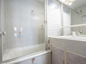 a bathroom with a shower and a sink at Apartment La Baie des Corsaires-1 by Interhome in Saint Malo
