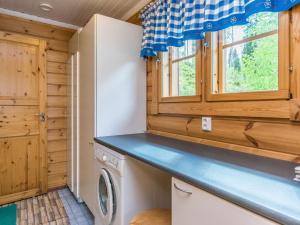 Kuchyň nebo kuchyňský kout v ubytování Holiday Home 7734 by Interhome