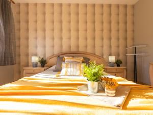 a bedroom with a large bed with a large headboard at Holiday Home Juan by Interhome in Riumar +18 photos