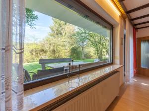 a large window in a room with a sink at Apartment Am Hohen Bogen-35 by Interhome in Arrach