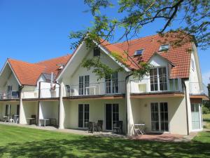 an exterior view of the house at Apartment Gollwitzer Park - Insel Poel-3 by Interhome in Gollwitz +23 photos