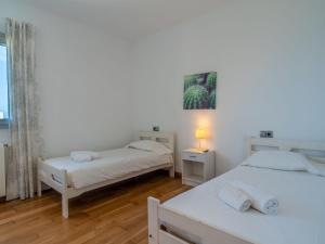 A bed or beds in a room at Villa Villa Mut by Interhome