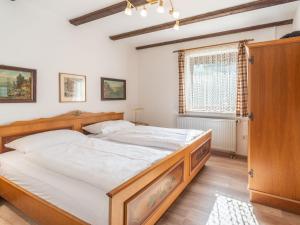 Ένα ή περισσότερα κρεβάτια σε δωμάτιο στο Apartment Am Hohen Bogen-62 by Interhome