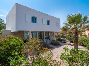 A garden outside Villa Villa Mut by Interhome