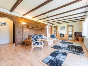 a large living room with a table and chairs at Apartment Am Hohen Bogen-58 by Interhome in Kummersdorf