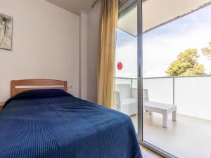 Posteľ alebo postele v izbe v ubytovaní Apartment Aquaria Atico by Interhome