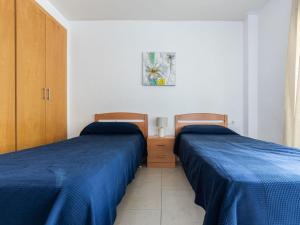 Posteľ alebo postele v izbe v ubytovaní Apartment Aquaria Atico by Interhome