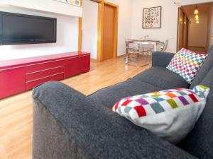 a living room with a couch and a tv at Apartment Barcelona Centric Apartment by Interhome in Barcelona