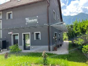 a building with a sign on the side of it at Panorama rooms in Bovec