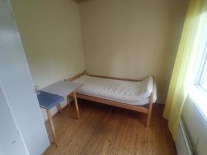 Postel nebo postele na pokoji v ubytování Selholmens Camping