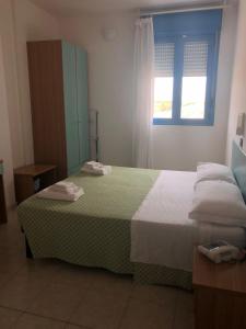 Posteľ alebo postele v izbe v ubytovaní Hotel Atlantic