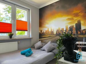 a bedroom with a mural of a city at Zupka room in Gdańsk