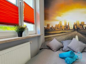 a bedroom with a window with a view of a city at Zupka room in Gdańsk