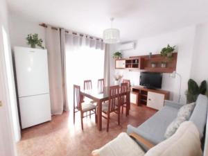 Televízia a/alebo spoločenská miestnosť v ubytovaní La Joya Apartment