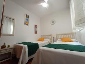 Posteľ alebo postele v izbe v ubytovaní La Joya Apartment