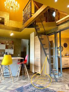 a living room with a loft bed and a kitchen at Hof Vierzehnender im Hohen Venn - 70qm Maisonette - 2 Schlafzimmer - Wohnküche - Balkon mit Grill - Monschau - Eifel - Hunde willkommen - Islandpferde in Monschau