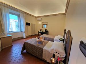 TV a/nebo společenská místnost v ubytování Palazzo Rosselmini