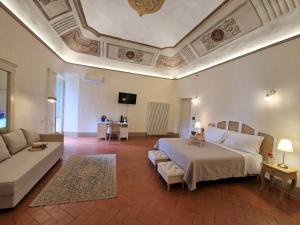 Postel nebo postele na pokoji v ubytování Palazzo Rosselmini