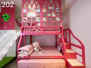 מיטה או מיטות בחדר ב-Wind Natural Parent-Child Inn II