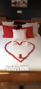 a heart made out of a bed with the words annavis home at Nandy's home in Odza II