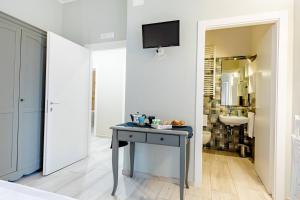 TV a/nebo společenská místnost v ubytování Torrelama Room & Breakfast