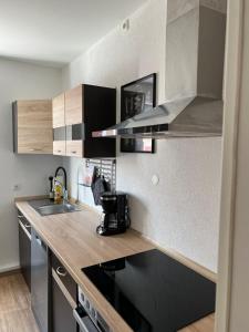 a kitchen with a sink and a stove top oven at Apartment in Weiden i. d. Opf. in Weiden