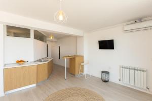 a kitchen with a sink and a counter in a room at Milena in Mamaia Sat/Năvodari