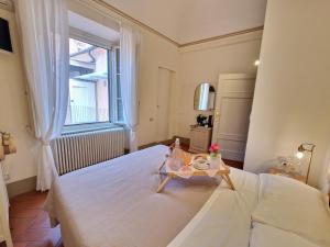 Postel nebo postele na pokoji v ubytování Palazzo Rosselmini