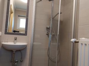 a bathroom with a sink and a shower at Apartment Tulpe by Interhome in Velden am Wörthersee