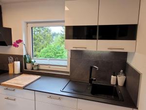 a kitchen with a sink and a window at Apartment Lercher by Interhome in Seefeld in Tirol