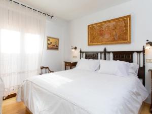 Giường trong phòng chung tại Holiday Home La Casita de Elvira by Interhome