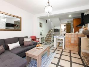 a living room with a couch and a table at Holiday Home Elvira by Interhome in Nigüelas