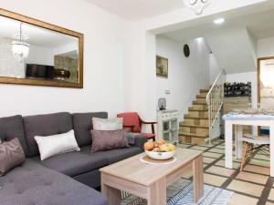 a living room with a couch and a table at Holiday Home Elvira by Interhome in Nigüelas