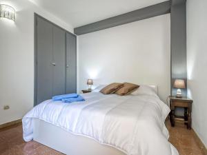 Posteľ alebo postele v izbe v ubytovaní Apartment Blaumar by Interhome